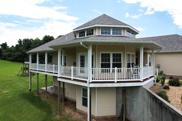 view of property exterior with a yard, a wooden deck, and a shingled roof