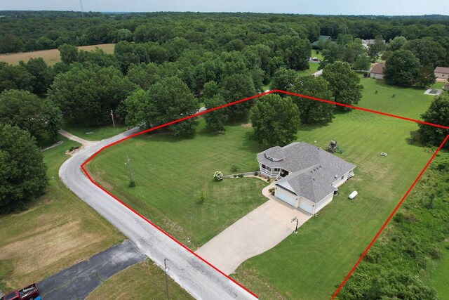 view of property location featuring property parcel outlined and a heavily wooded area