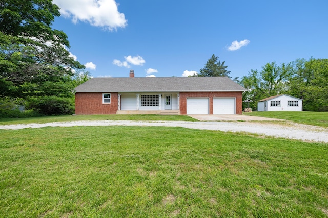 14155 State Highway T, Weaubleau, MO 65774 - ranch-style house with brick siding, dirt driveway, a front lawn, and an attached garage
