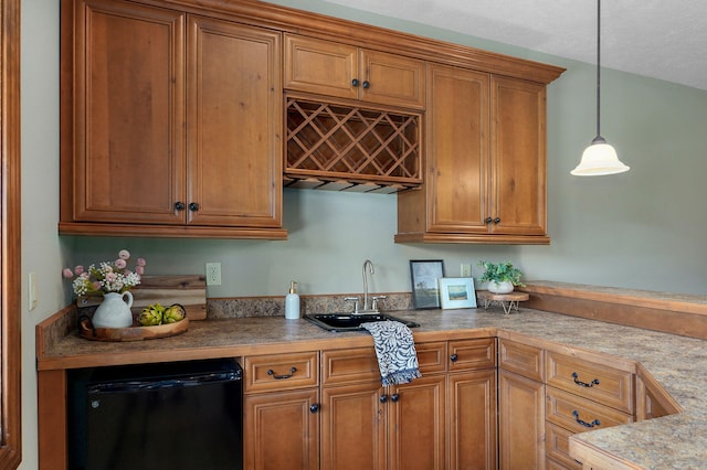 6046 S Parkhaven Ln, Springfield, MO 65810 - kitchen featuring refrigerator, a sink, brown cabinets, and decorative light fixtures