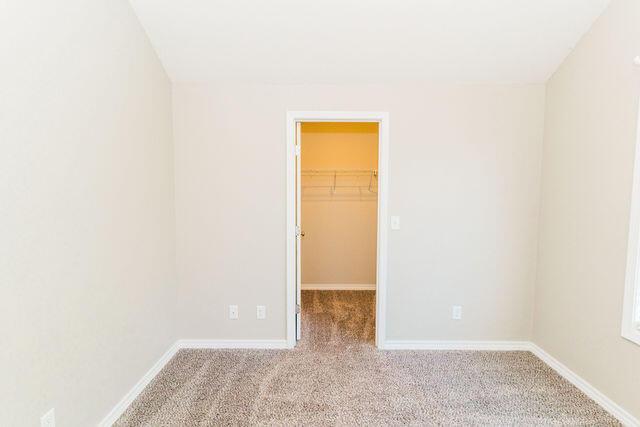 1205 N 12th Ave, Ozark, MO 65721 - spare room with carpet