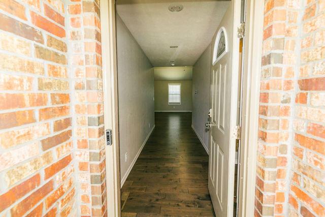 1205 N 12th Ave, Ozark, MO 65721 - hall featuring dark wood finished floors