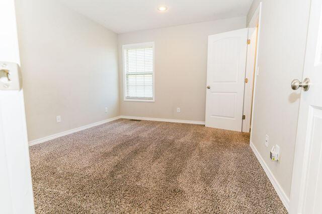 1205 N 12th Ave, Ozark, MO 65721 - carpeted empty room featuring recessed lighting and baseboards