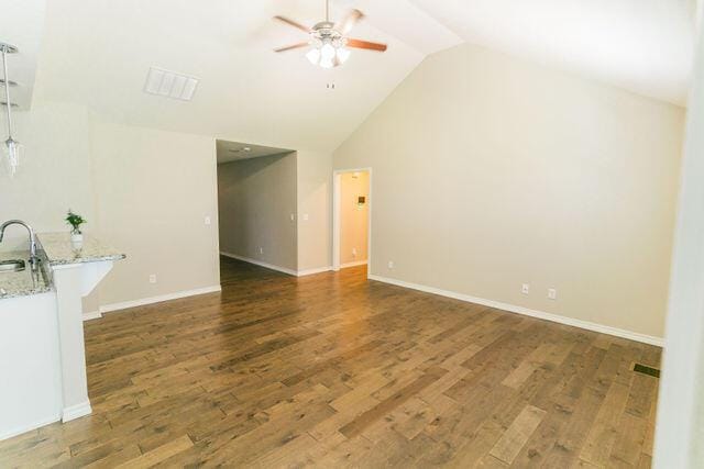 1205 N 12th Ave, Ozark, MO 65721 - unfurnished living room with ceiling fan, lofted ceiling, and wood finished floors