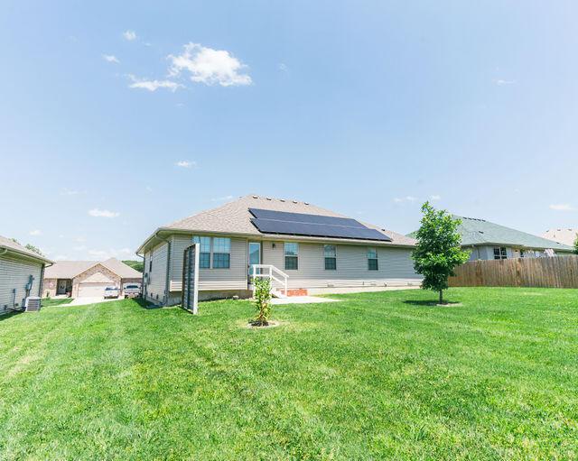 1205 N 12th Ave, Ozark, MO 65721 - back of property featuring solar panels