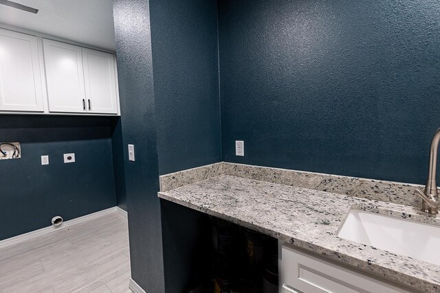 1935 E Canterbury St, Springfield, MO 65804 - bathroom featuring baseboards, wood finished floors, and vanity