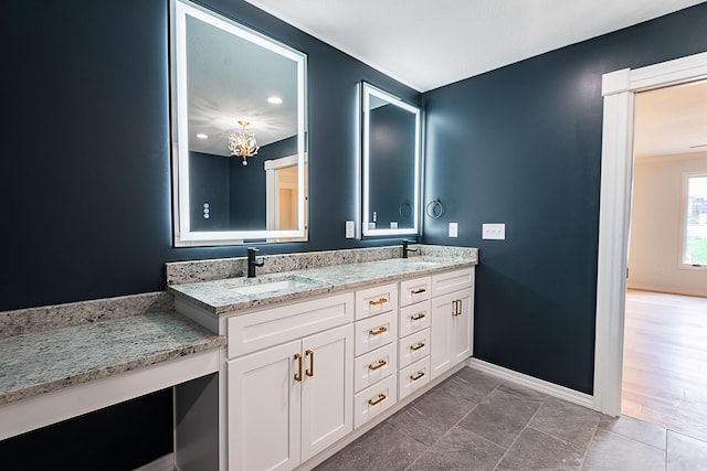 1935 E Canterbury St, Springfield, MO 65804 - full bathroom featuring baseboards, double vanity, and a chandelier