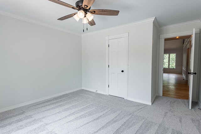 1935 E Canterbury St, Springfield, MO 65804 - unfurnished bedroom with carpet floors, ornamental molding, baseboards, and a ceiling fan