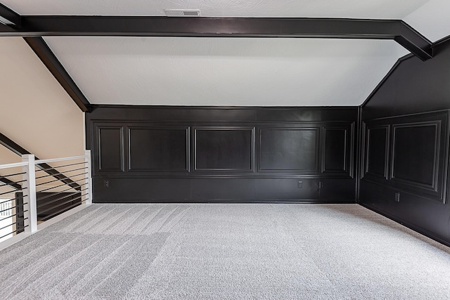 1935 E Canterbury St, Springfield, MO 65804 - interior space with carpet flooring, lofted ceiling, and a decorative wall