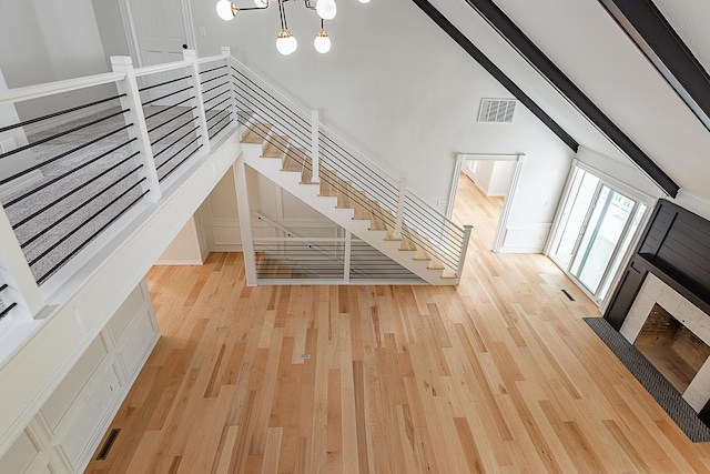 1935 E Canterbury St, Springfield, MO 65804 - unfurnished living room with wood finished floors and lofted ceiling