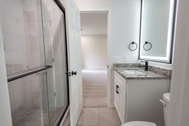 1935 E Canterbury St, Springfield, MO 65804 - full bathroom with a stall shower, toilet, and vanity