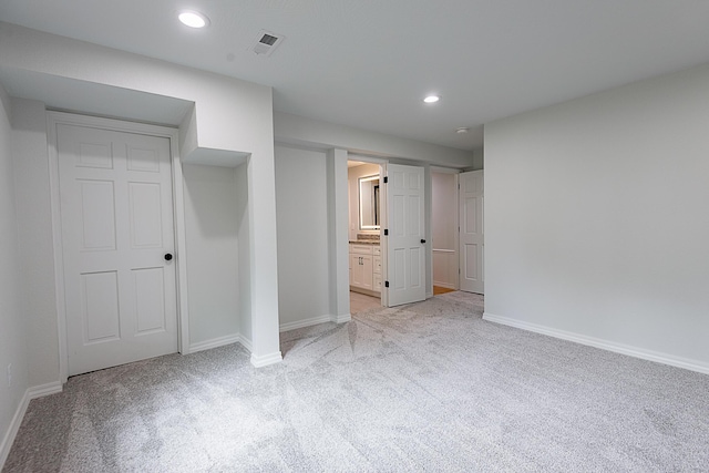 1935 E Canterbury St, Springfield, MO 65804 - unfurnished bedroom featuring light colored carpet, baseboards, recessed lighting, and ensuite bathroom
