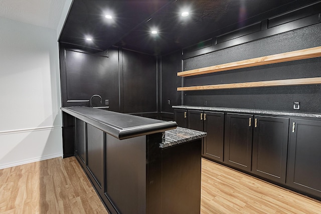 1935 E Canterbury St, Springfield, MO 65804 - kitchen featuring open shelves, a peninsula, light wood finished floors, baseboards, and recessed lighting