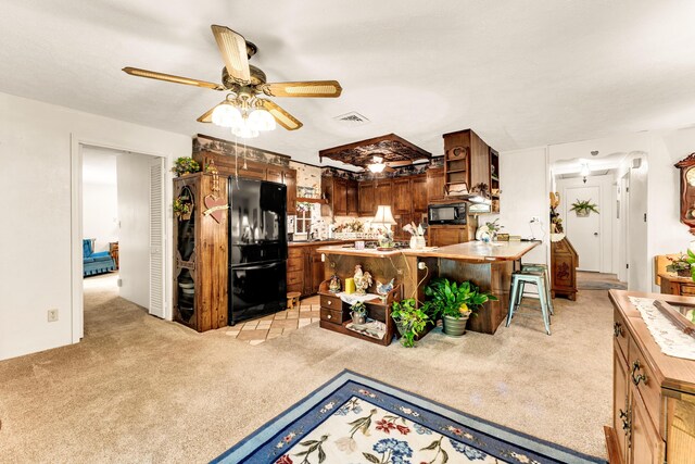 3152 Two Rivers Rd, Highlandville, MO 65669 - kitchen with black appliances, light carpet, open shelves, and ceiling fan