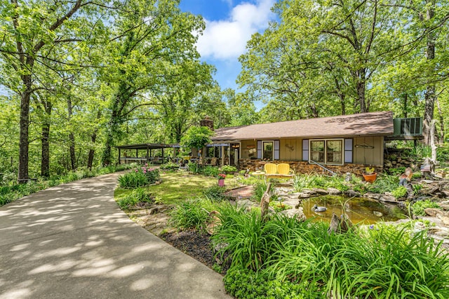 3152 Two Rivers Rd, Highlandville, MO 65669 - view of front of house with a chimney and board and batten siding