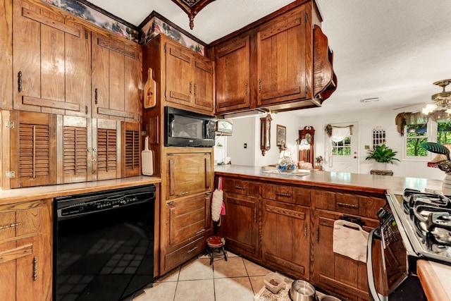 3152 Two Rivers Rd, Highlandville, MO 65669 - kitchen featuring black appliances, light tile patterned floors, light countertops, and brown cabinets