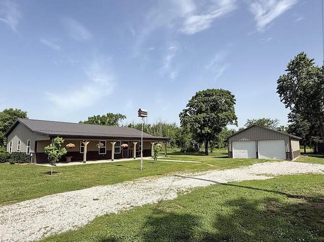 30285 E Pawhuska Rd, El Dorado Springs, MO 64744 - view of green lawn with a detached garage and an outdoor structure