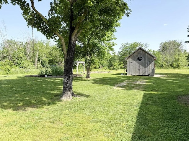 30285 E Pawhuska Rd, El Dorado Springs, MO 64744 - view of green lawn with a shed and an outbuilding