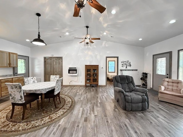 30285 E Pawhuska Rd, El Dorado Springs, MO 64744 - dining room with vaulted ceiling, ceiling fan, heating unit, light wood finished floors, and recessed lighting
