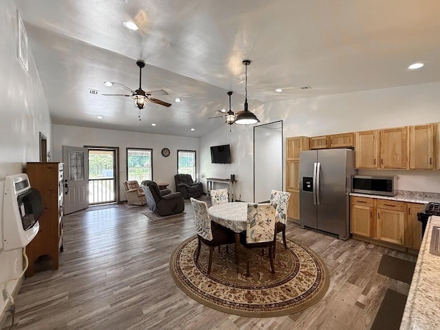 30285 E Pawhuska Rd, El Dorado Springs, MO 64744 - dining area featuring vaulted ceiling, a ceiling fan, wood finished floors, and recessed lighting