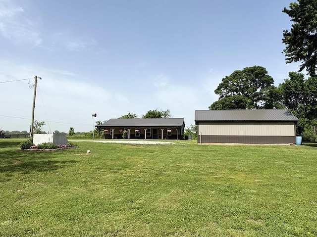 30285 E Pawhuska Rd, El Dorado Springs, MO 64744 - view of home's community with a lawn and an outbuilding