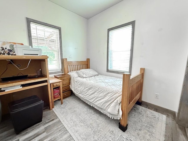30285 E Pawhuska Rd, El Dorado Springs, MO 64744 - bedroom with light wood-style flooring