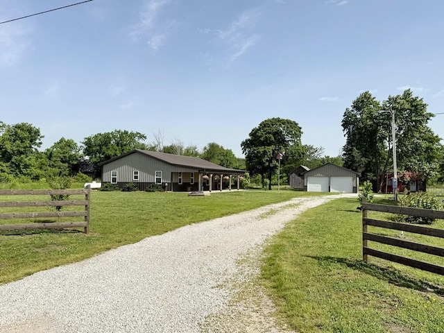 30285 E Pawhuska Rd, El Dorado Springs, MO 64744 - single story home with a garage, gravel driveway, and an outdoor structure