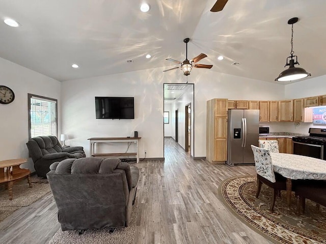 30285 E Pawhuska Rd, El Dorado Springs, MO 64744 - living room featuring a ceiling fan, vaulted ceiling, light wood finished floors, baseboards, and recessed lighting