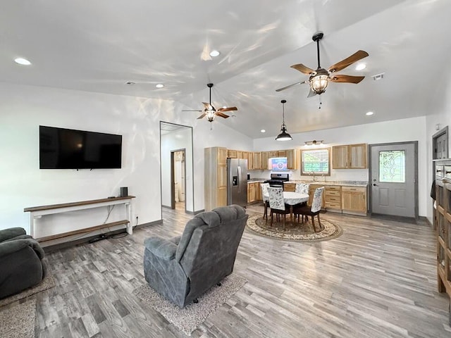 30285 E Pawhuska Rd, El Dorado Springs, MO 64744 - living room featuring light wood-style flooring, ceiling fan, vaulted ceiling, recessed lighting, and baseboards