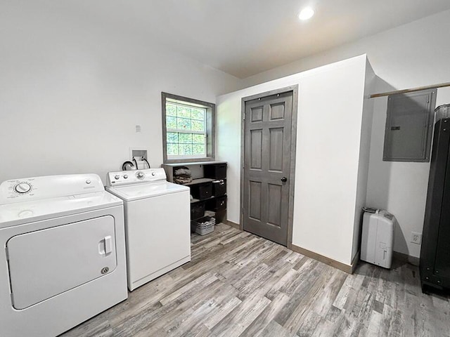 30285 E Pawhuska Rd, El Dorado Springs, MO 64744 - washroom featuring separate washer and dryer, light wood-style flooring, electric panel, baseboards, and recessed lighting
