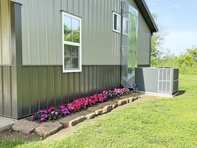 30285 E Pawhuska Rd, El Dorado Springs, MO 64744 - view of side of home with central AC and a lawn