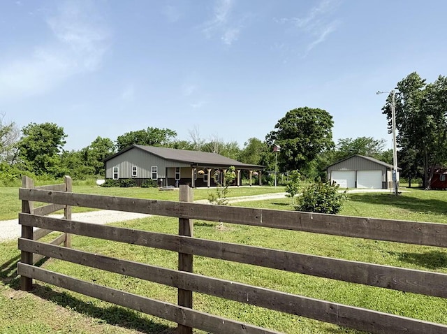 30285 E Pawhuska Rd, El Dorado Springs, MO 64744 - view of yard with a detached garage, an outdoor structure, and driveway
