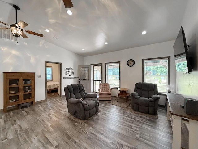 30285 E Pawhuska Rd, El Dorado Springs, MO 64744 - living area featuring a ceiling fan, vaulted ceiling, wood finished floors, recessed lighting, and baseboards