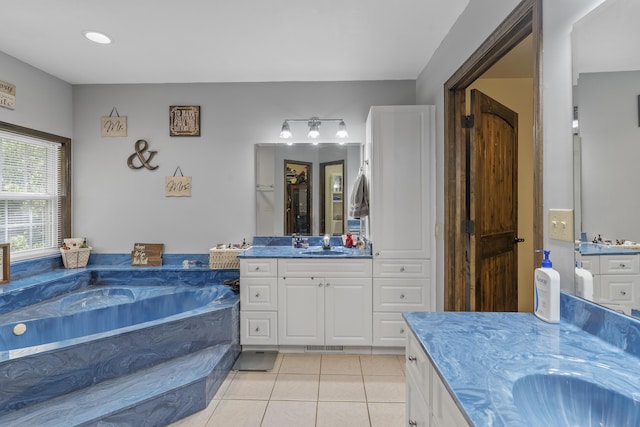 45 Stone Ridge Ct, Strafford, MO 65757 - bathroom with tile patterned floors, a bath, and two vanities