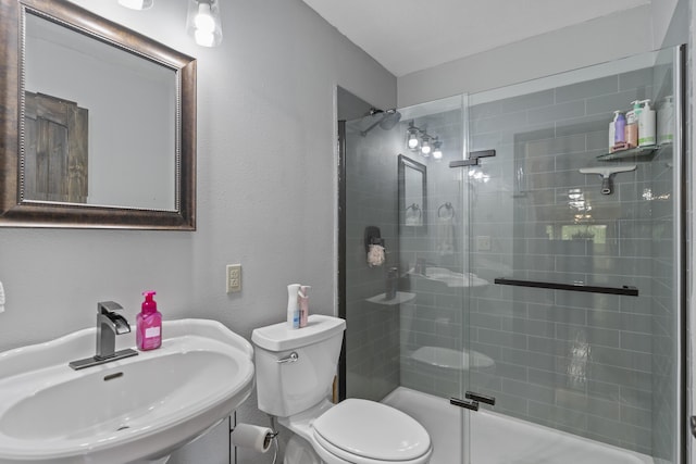 45 Stone Ridge Ct, Strafford, MO 65757 - bathroom with a sink, a stall shower, toilet, and a textured wall