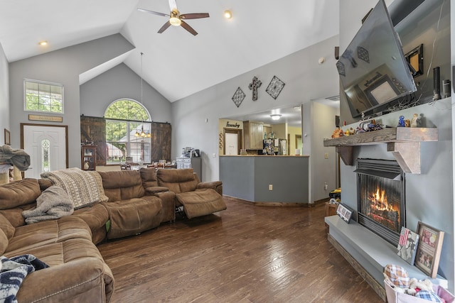 45 Stone Ridge Ct, Strafford, MO 65757 - living room with high vaulted ceiling, a lit fireplace, hardwood / wood-style flooring, and ceiling fan