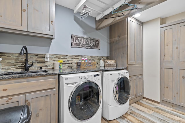45 Stone Ridge Ct, Strafford, MO 65757 - clothes washing area featuring cabinet space, washer and clothes dryer, and light wood finished floors