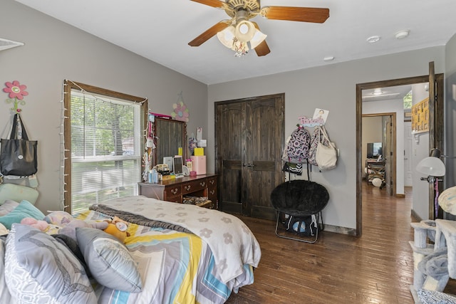 45 Stone Ridge Ct, Strafford, MO 65757 - bedroom featuring dark wood-style flooring, a closet, a ceiling fan, and baseboards