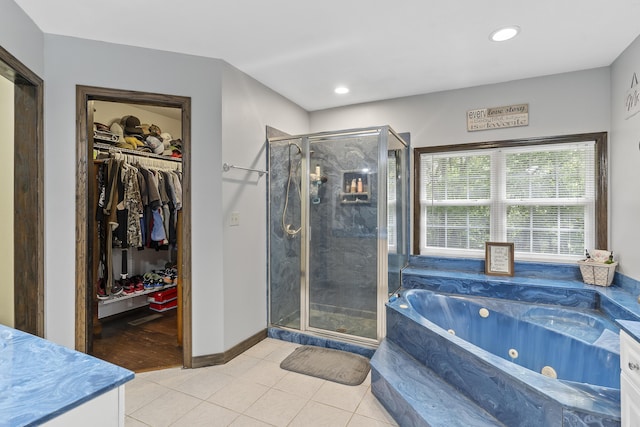 45 Stone Ridge Ct, Strafford, MO 65757 - full bath featuring a shower stall, a jetted tub, tile patterned flooring, a spacious closet, and recessed lighting