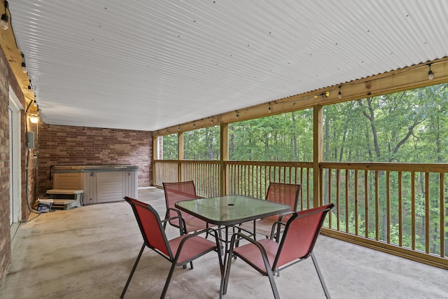 45 Stone Ridge Ct, Strafford, MO 65757 - sunroom featuring a hot tub and outdoor dining area