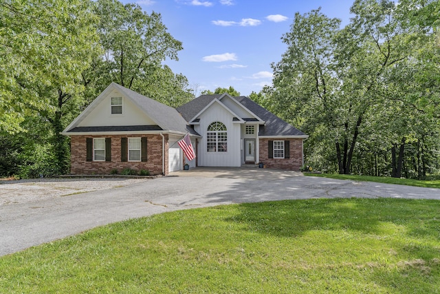 45 Stone Ridge Ct, Strafford, MO 65757 - view of front of property featuring driveway, a front yard, brick siding, and roof with shingles