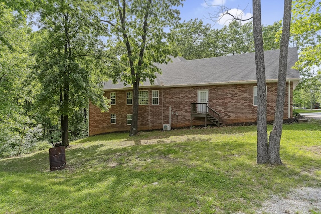 45 Stone Ridge Ct, Strafford, MO 65757 - view of side of home with a lawn, a shingled roof, and brick siding