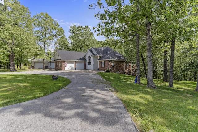 45 Stone Ridge Ct, Strafford, MO 65757 - view of front of house featuring asphalt driveway, a front yard, a garage, and brick siding