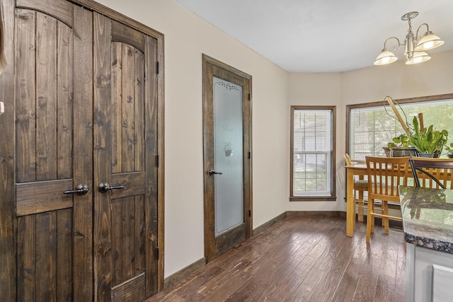 45 Stone Ridge Ct, Strafford, MO 65757 - dining area with dark wood-style flooring, a chandelier, and baseboards