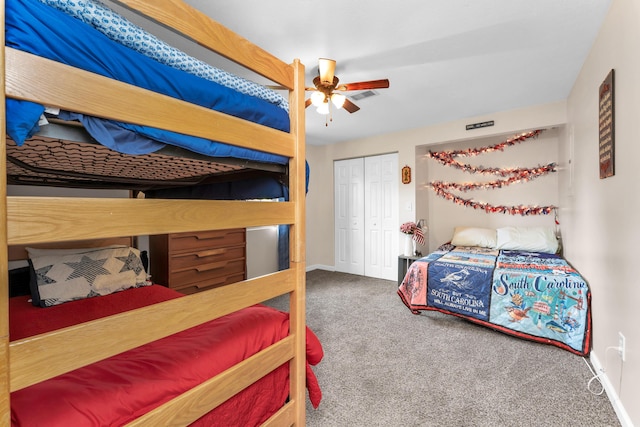 301 Lake Dr, Branson, MO 65616 - bedroom with carpet, a closet, baseboards, and a ceiling fan