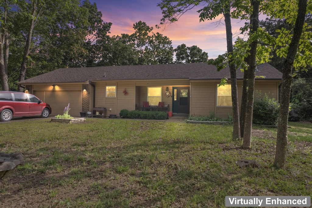 150 Meadow Ave, Branson, MO 65616 - ranch-style home featuring a front lawn, a garage, and a porch