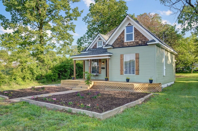 1301 E Locust St, Springfield, MO 65803 - view of front of home with a porch, a front yard, and a shingled roof