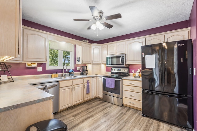 1163 S Gregg Rd, Nixa, MO 65714 - kitchen featuring appliances with stainless steel finishes, a sink, light brown cabinets, ceiling fan, and light wood finished floors