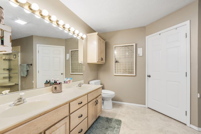 1163 S Gregg Rd, Nixa, MO 65714 - full bath with baseboards, toilet, an enclosed shower, and double vanity