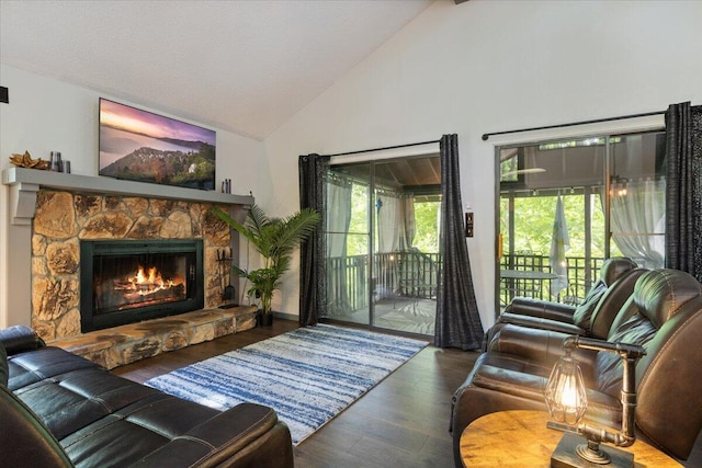 91 Moongate Dr, Osage Beach, MO 65065 - living area featuring wood finished floors, a fireplace, healthy amount of natural light, and high vaulted ceiling